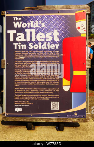 A plaque describing the story behind the world`s tallest tin soldier in New Westminster, B. C., Canada. Stock Photo